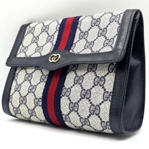 Gucci Monogram Clutch with Navy and Red Accents